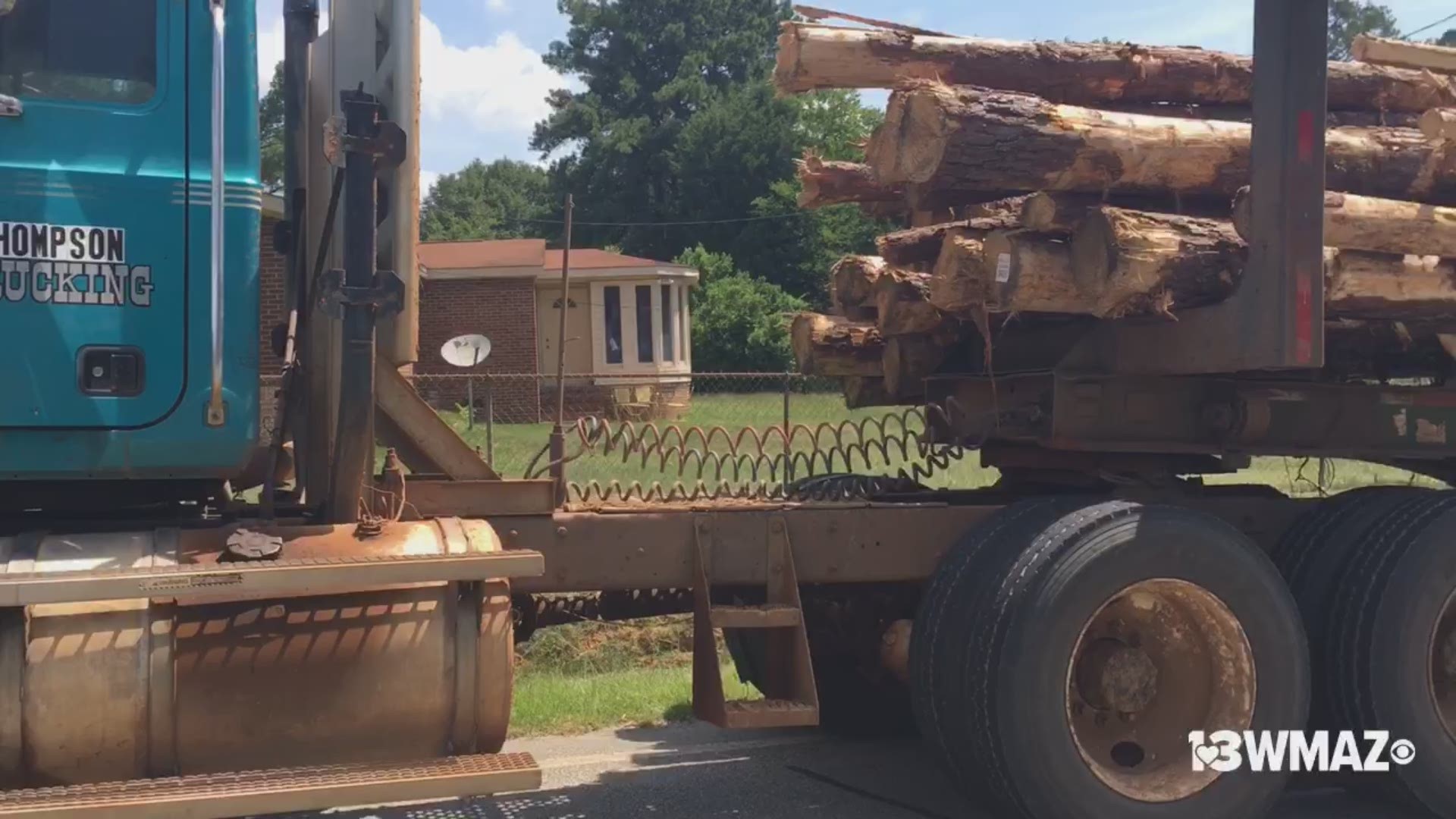 Jeffersonville Road is blocked after a log truck spilled its load Thursday morning. No one was injured in the crash, but a gas main was hit.