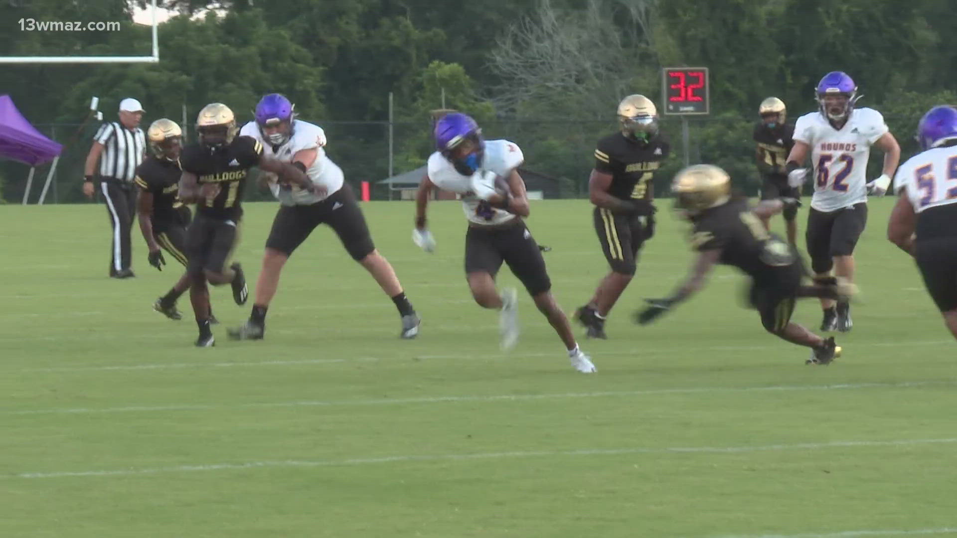 The Bulldogs matched up against the Greyhounds one week before high school football's regular season kicked off in Georgia.