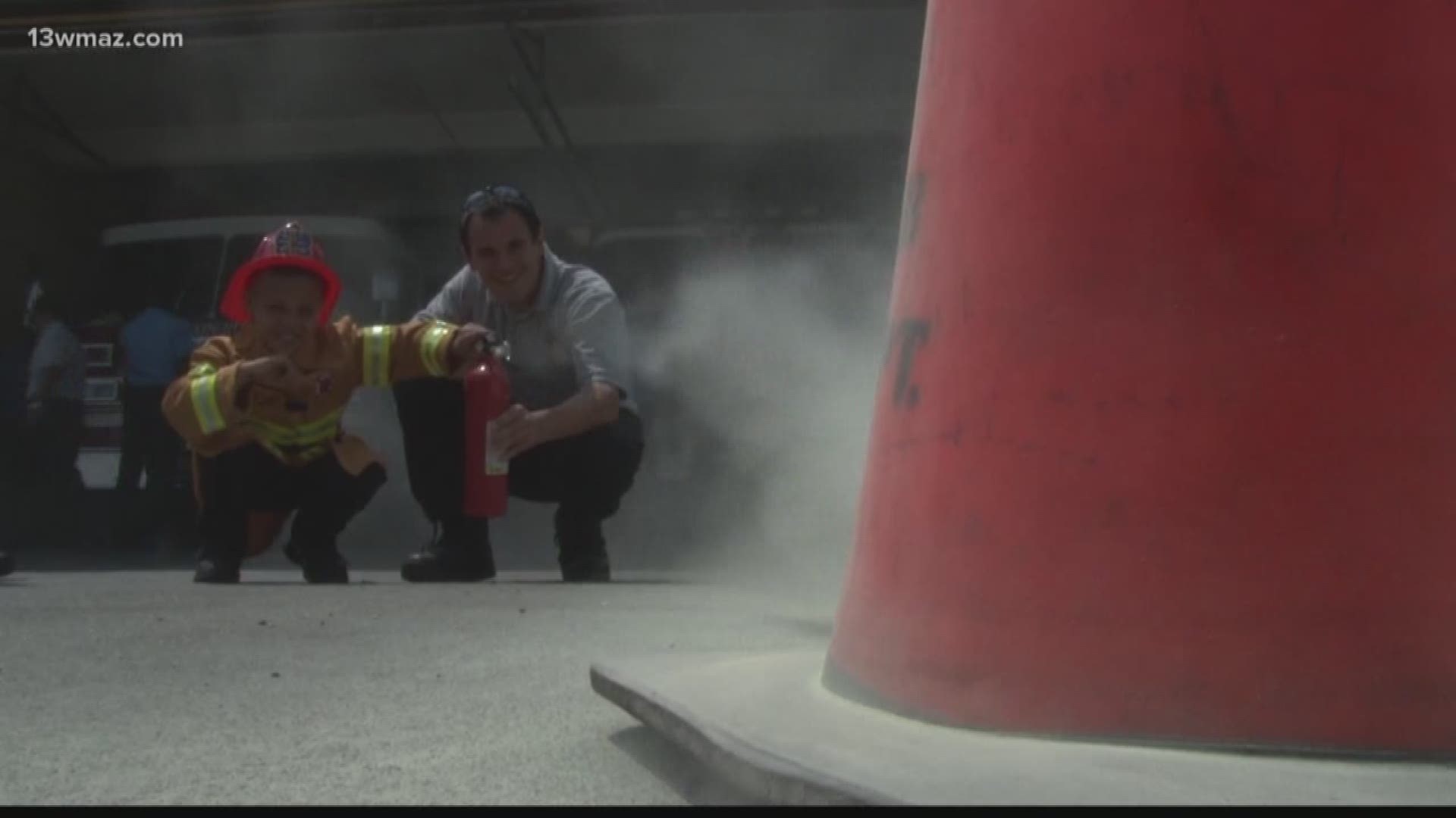 Disabled child receives fire extinguisher