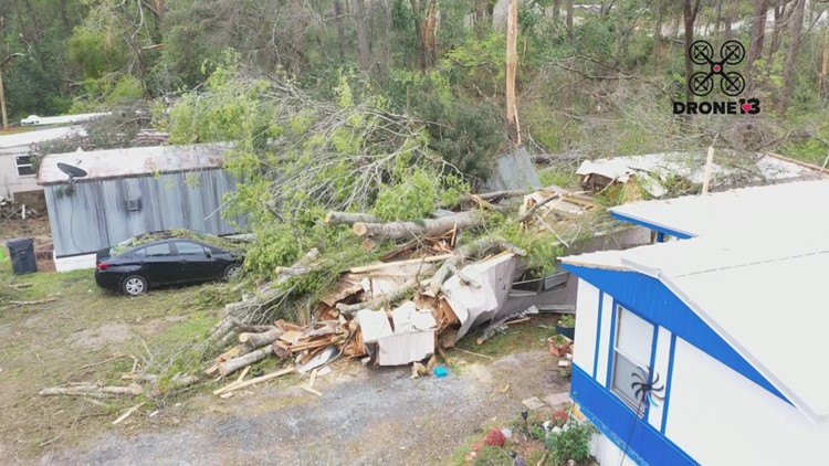 Baldwin County woman escapes after large trees crash into mobile home