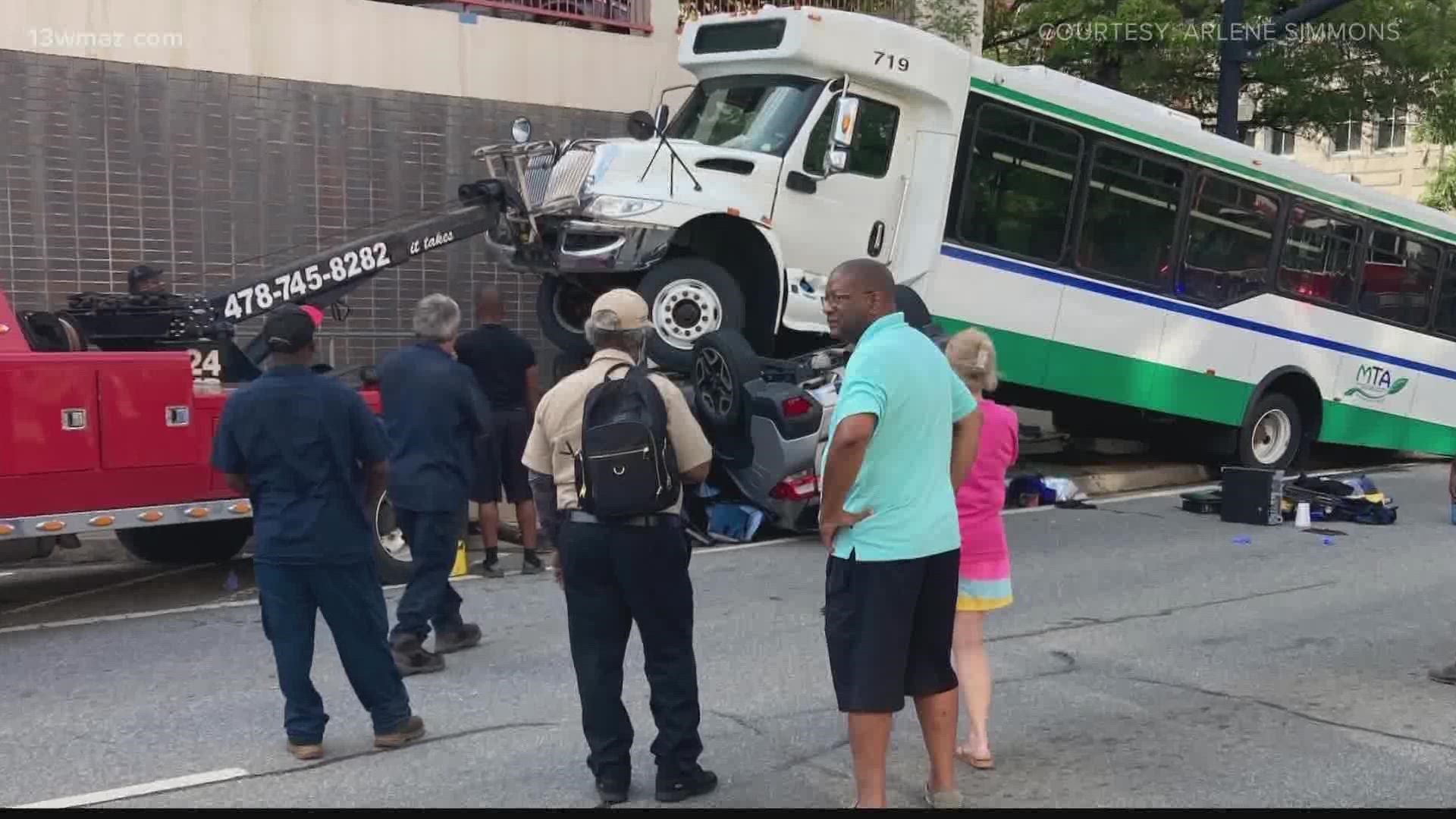 A crash report from the Bibb Sheriff's Office shows the driver of a Subaru SUV was making a left turn from MLK onto Cherry Street and the bus ran the red light