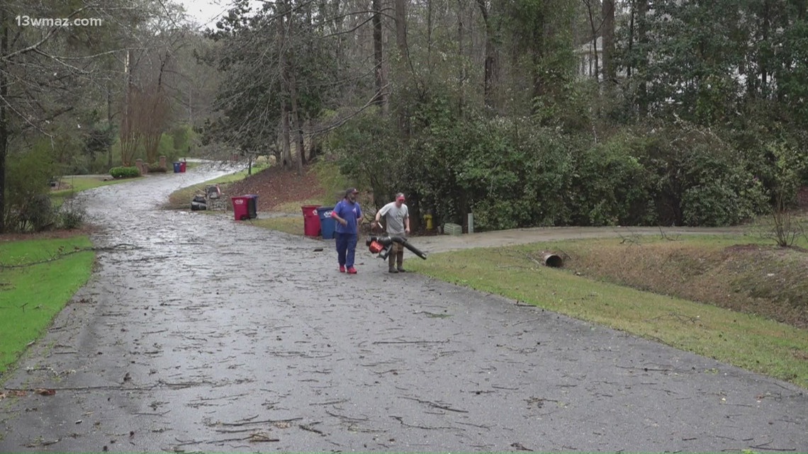 Neighbors clean up after severe storm damages part of North