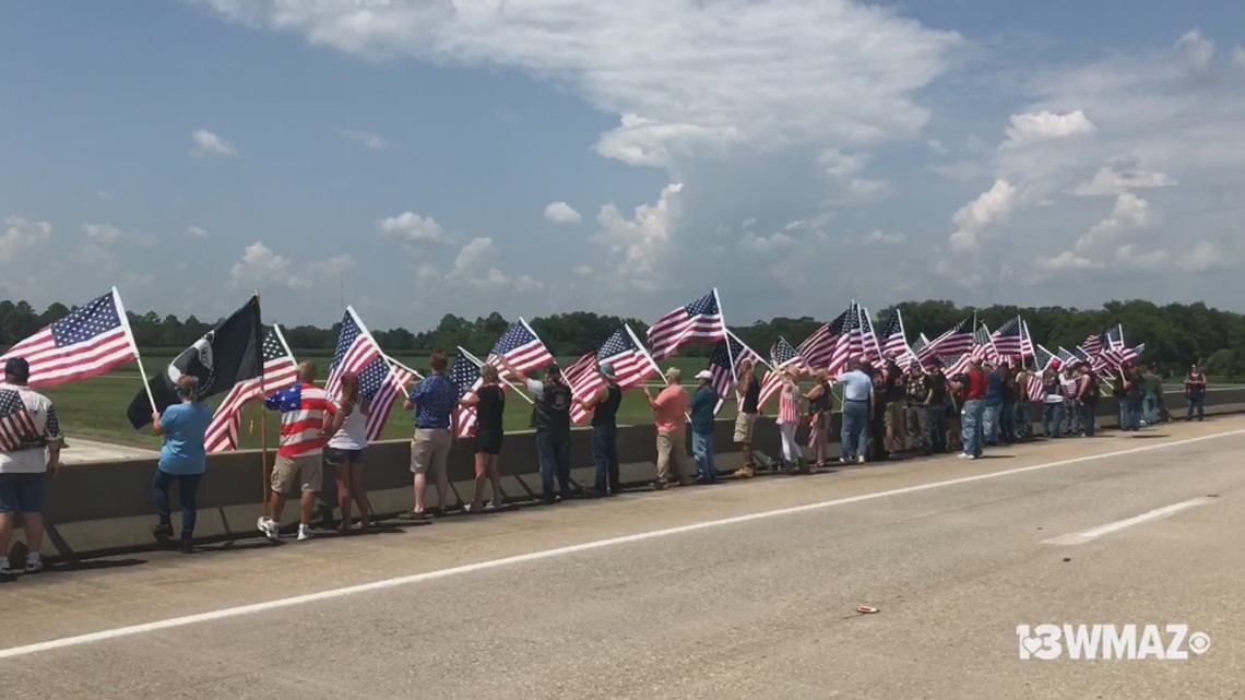Flags line I75 overpass in Warner Robins