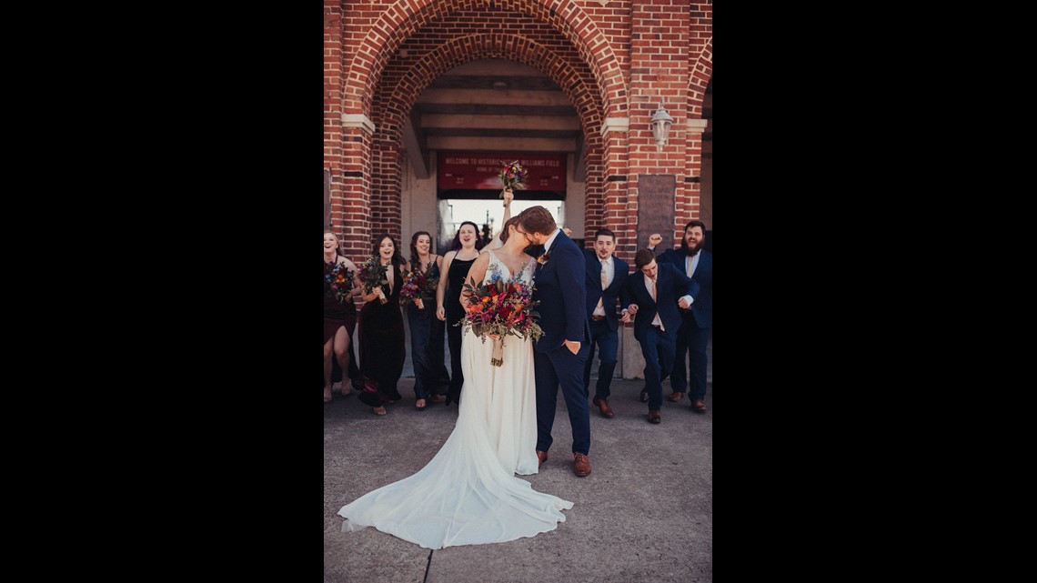 Macon couple gets married at Luther Williams field