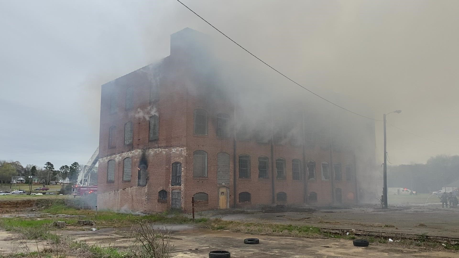 Macon-Bibb Fire crews put out a blaze at an abandoned warehouse near the Centreplex Tuesday morning