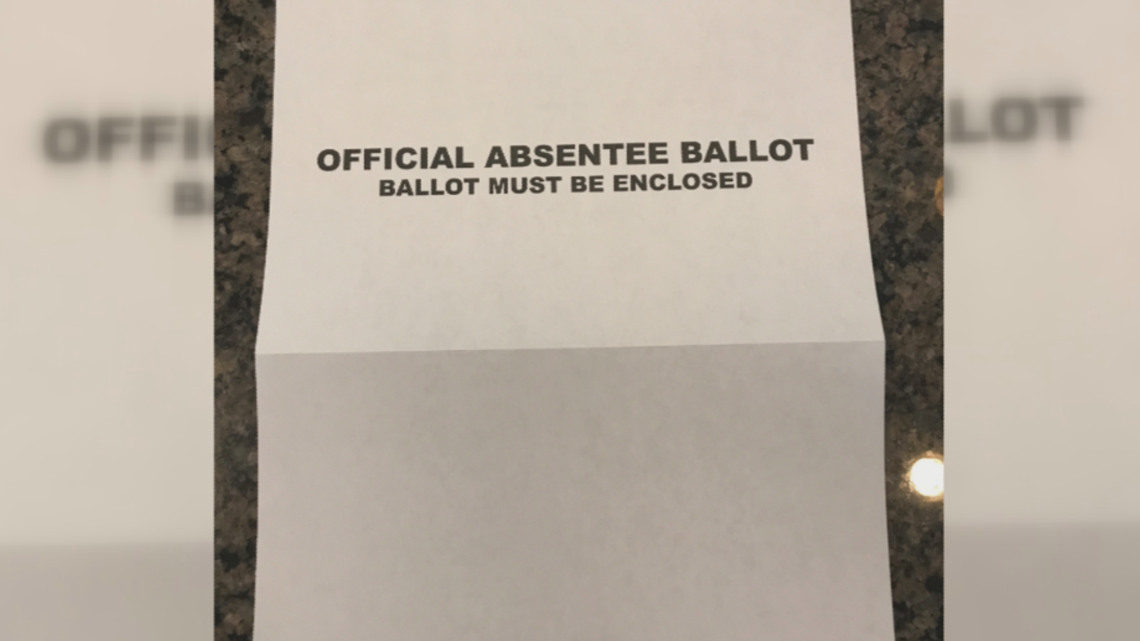 Where is the white envelope for absentee ballots?