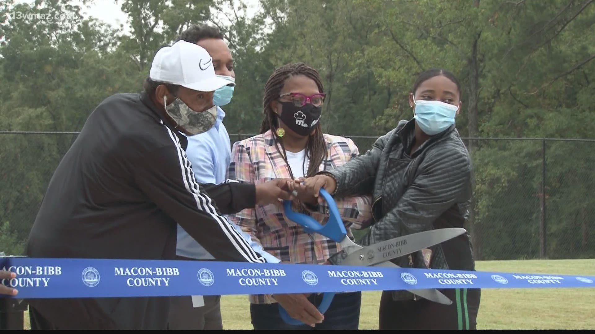 People in west Macon and city officials gathered to cut ribbon for the second phase of Filmore Thomas Park.