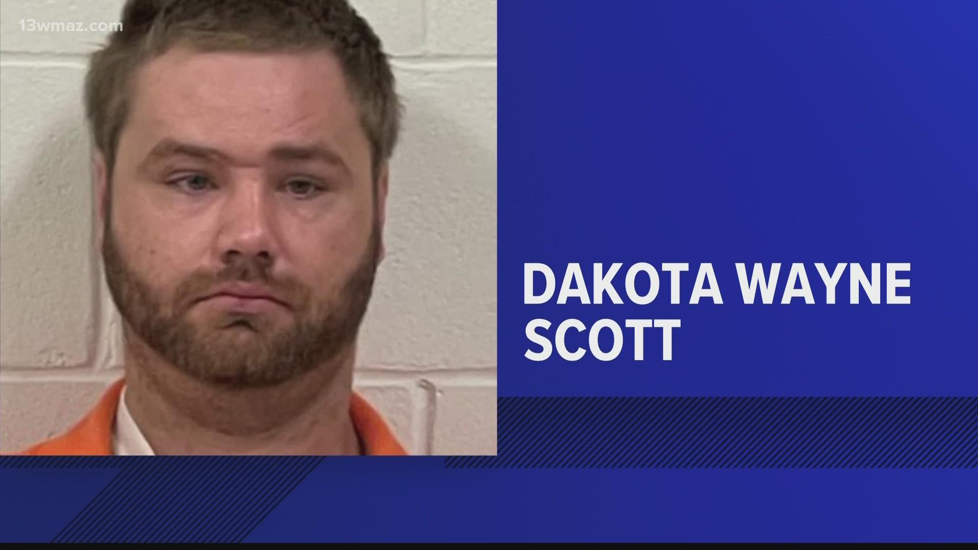 Dakota Wayne Scott, 27, was arrested and charged with two counts of felony murder and one count of felony tampering with evidence