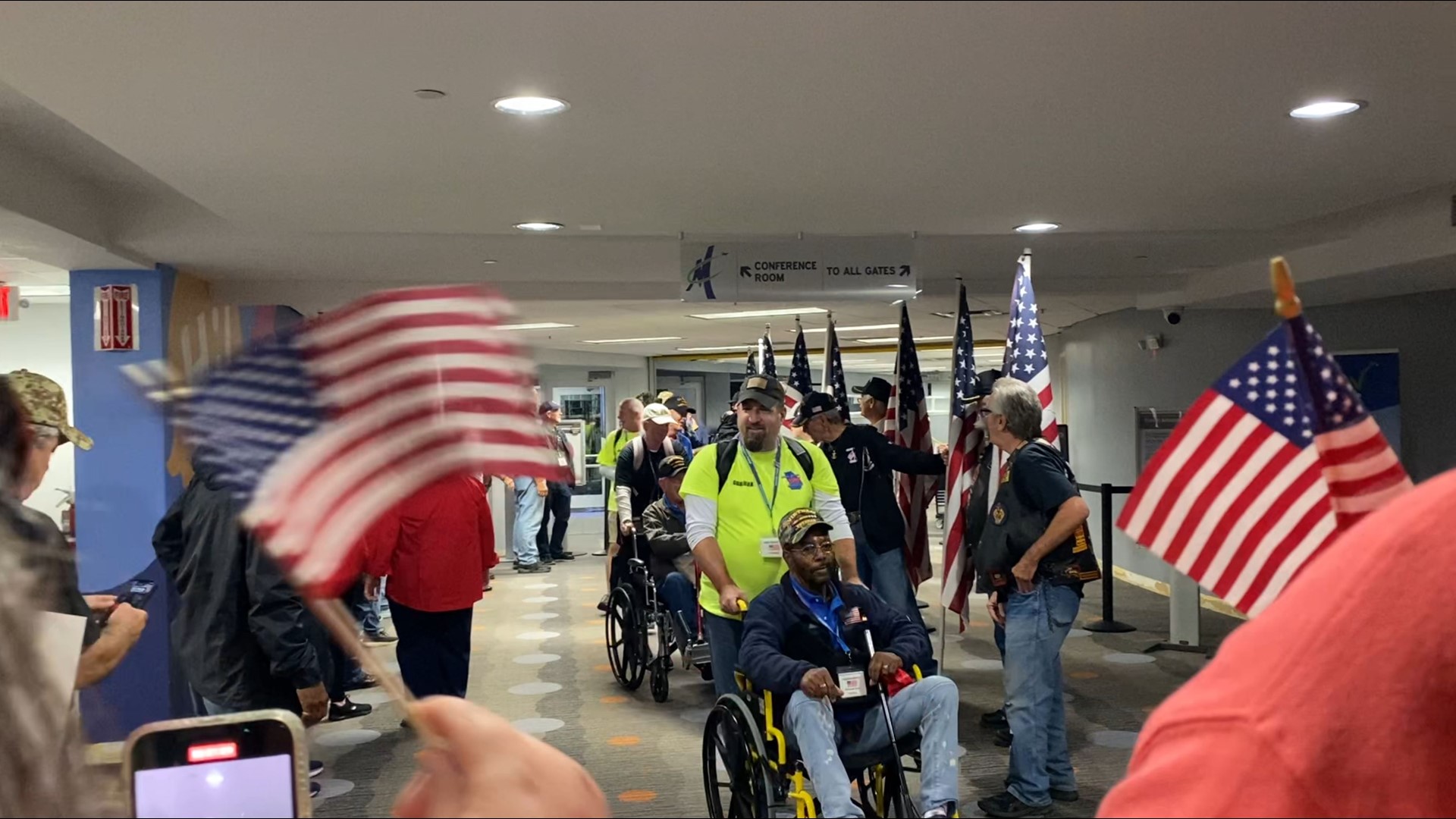 Several folks lined up to greet the veterans ahead of the honor flight.