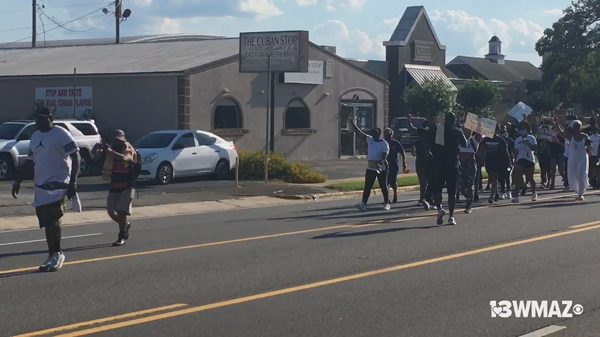 Hundreds marched down Watson Blvd. during a peaceful protest Saturday afternoon.