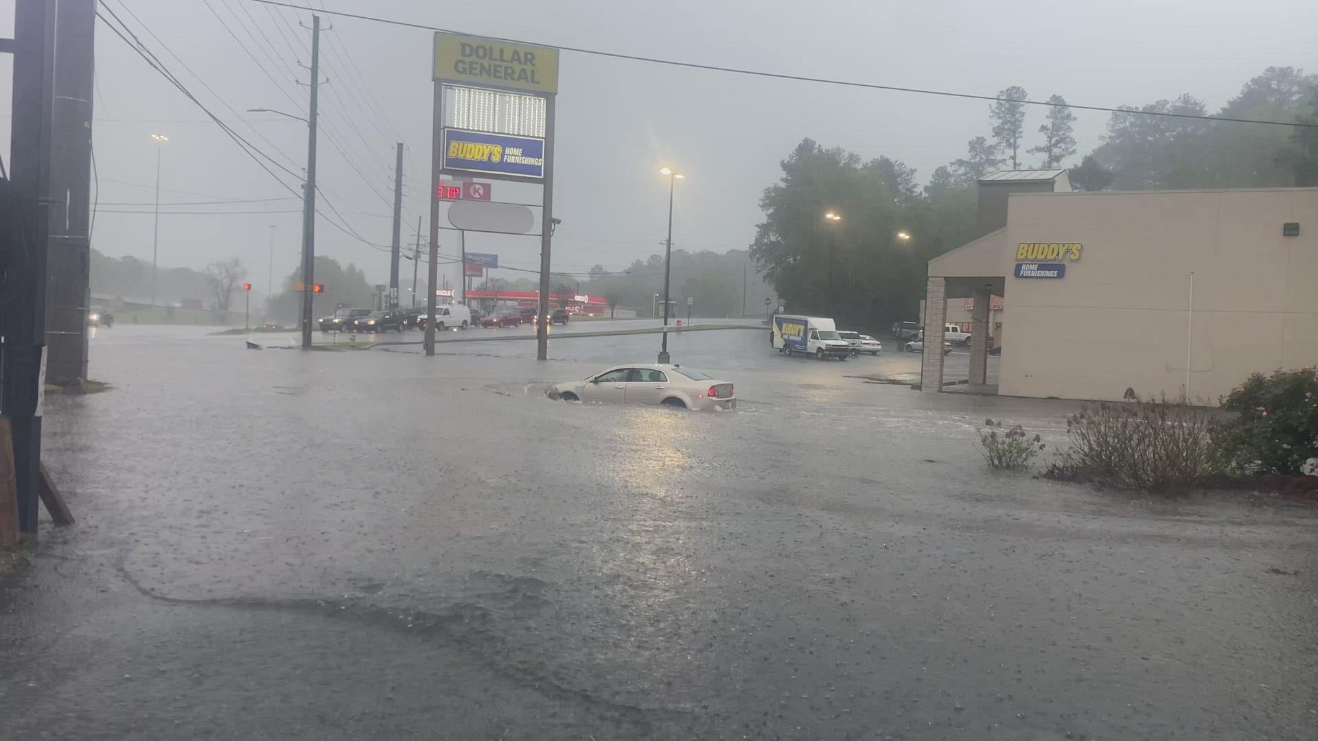 A car drives in Macon through the storm water in Central Georgia.