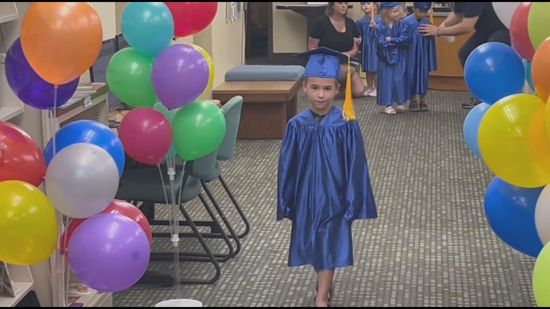 Children who met their reading goals in the 1KB4K program got to walk in their cap and gowns and get a certificate of completion.