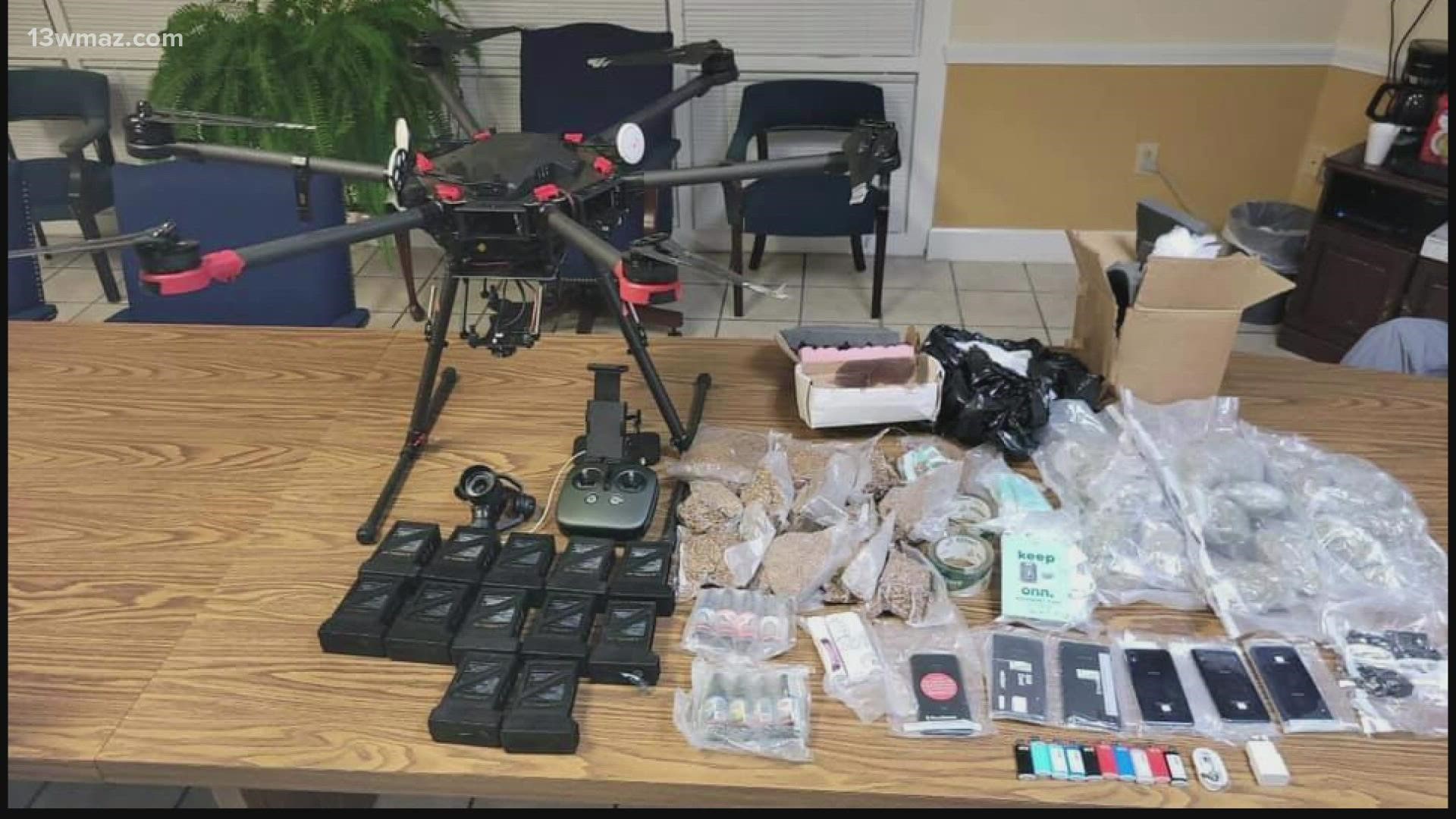 A photo from the drop shows batteries, lighters, cellphones, phone chargers, rolling papers and marijuana.