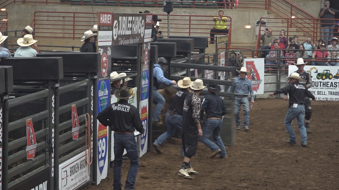 Houston County Sheriff Matt Moulton rides bull for Georgia Sheriffs' Youth Homes at bull riding event
