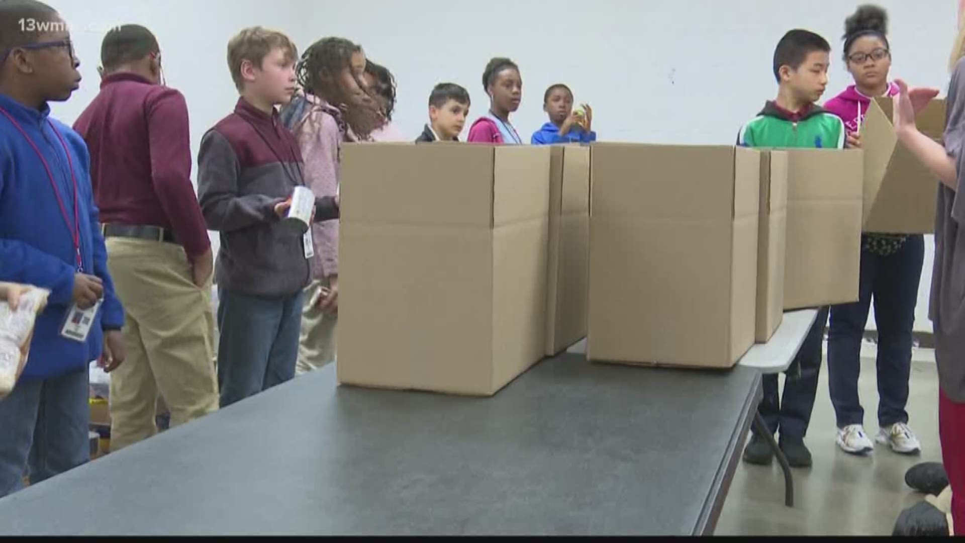 Around 30 gifted students from Carter, Union, and Lane Elementary exchanged their pencils and papers to pack more than a dozen boxes of food on a field trip