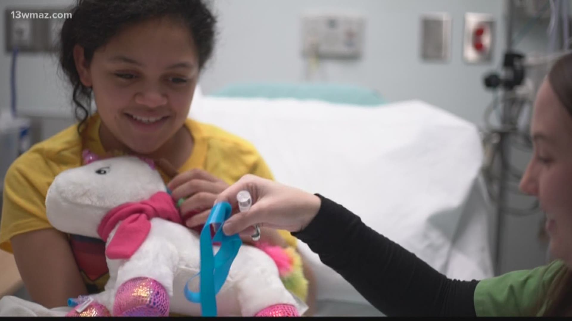At the Beverly Knight Olson Children's Hospital, Child Life Specialists explain procedures to children, play with them, and help distract them.