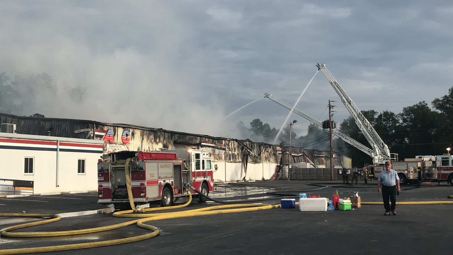 The warehouse caught on fire around 5:30 p.m. Friday. The fire was still burning Saturday morning and investigators are searching for the cause.