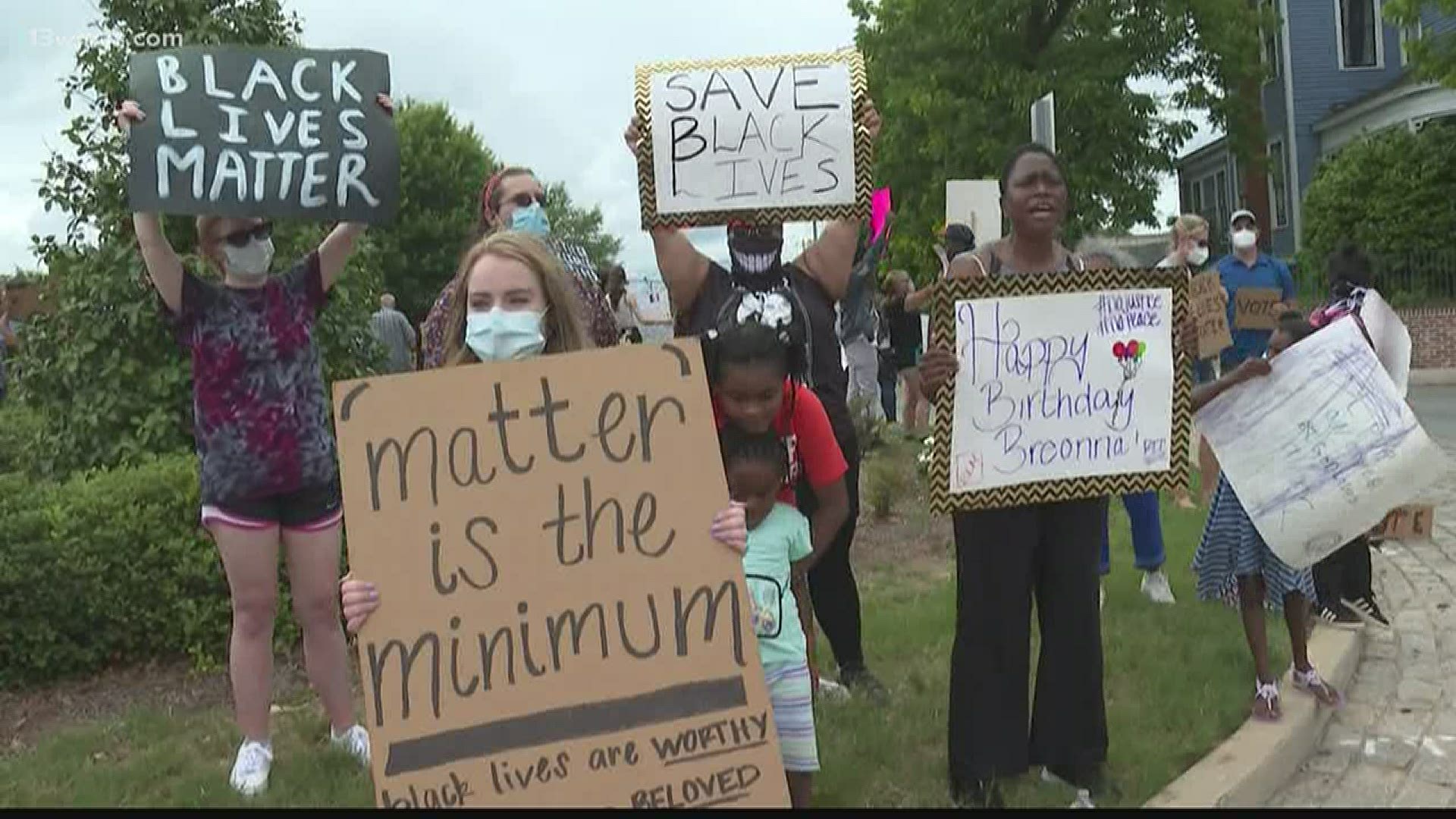 Community members gather for peaceful protest in Tattnall Square Park.