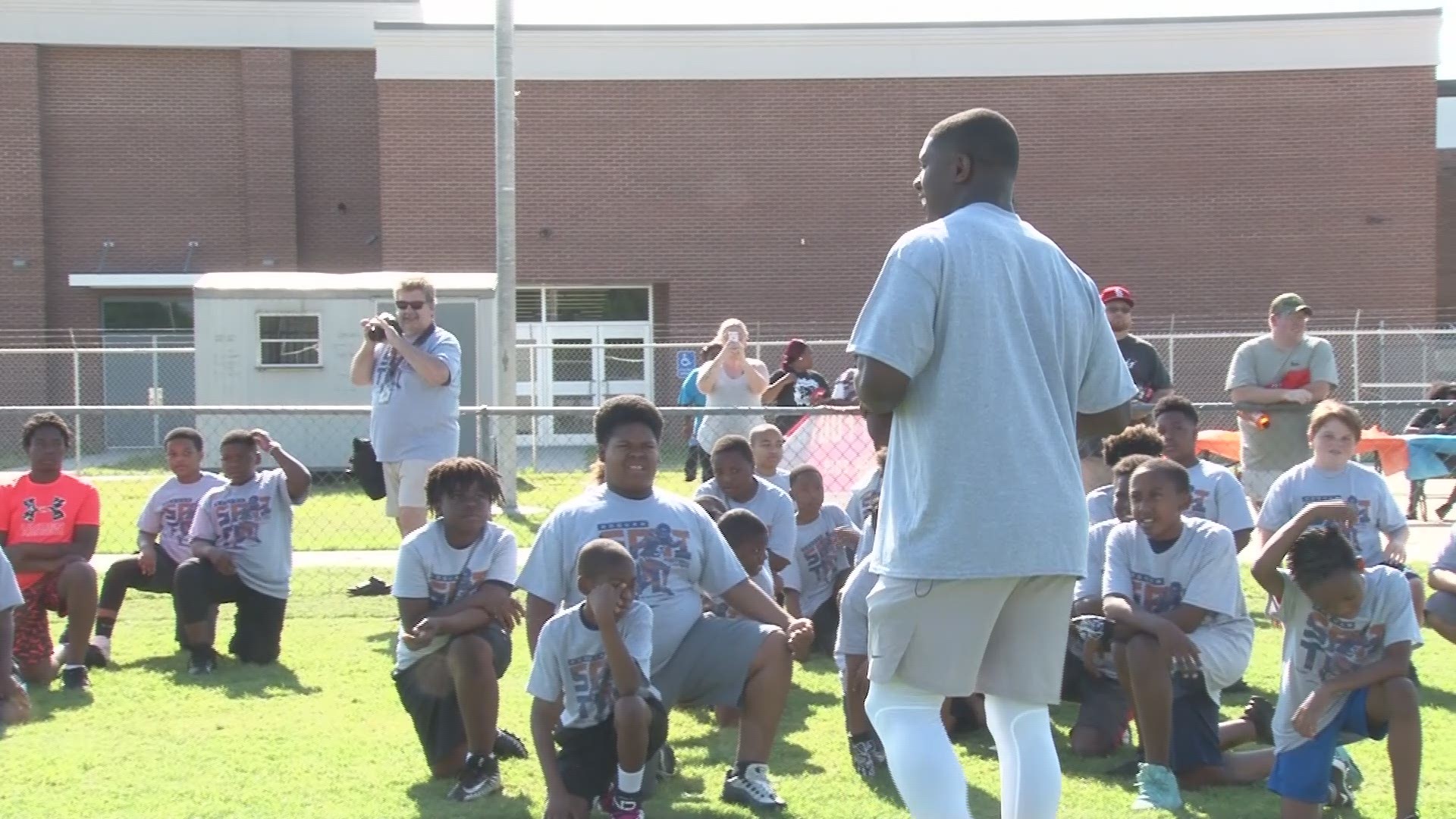 More than 200 children were at the stadium for Roquan Smith's football camp. The NFL linebacker plans to return home every summer to spend time coaching in Montezuma