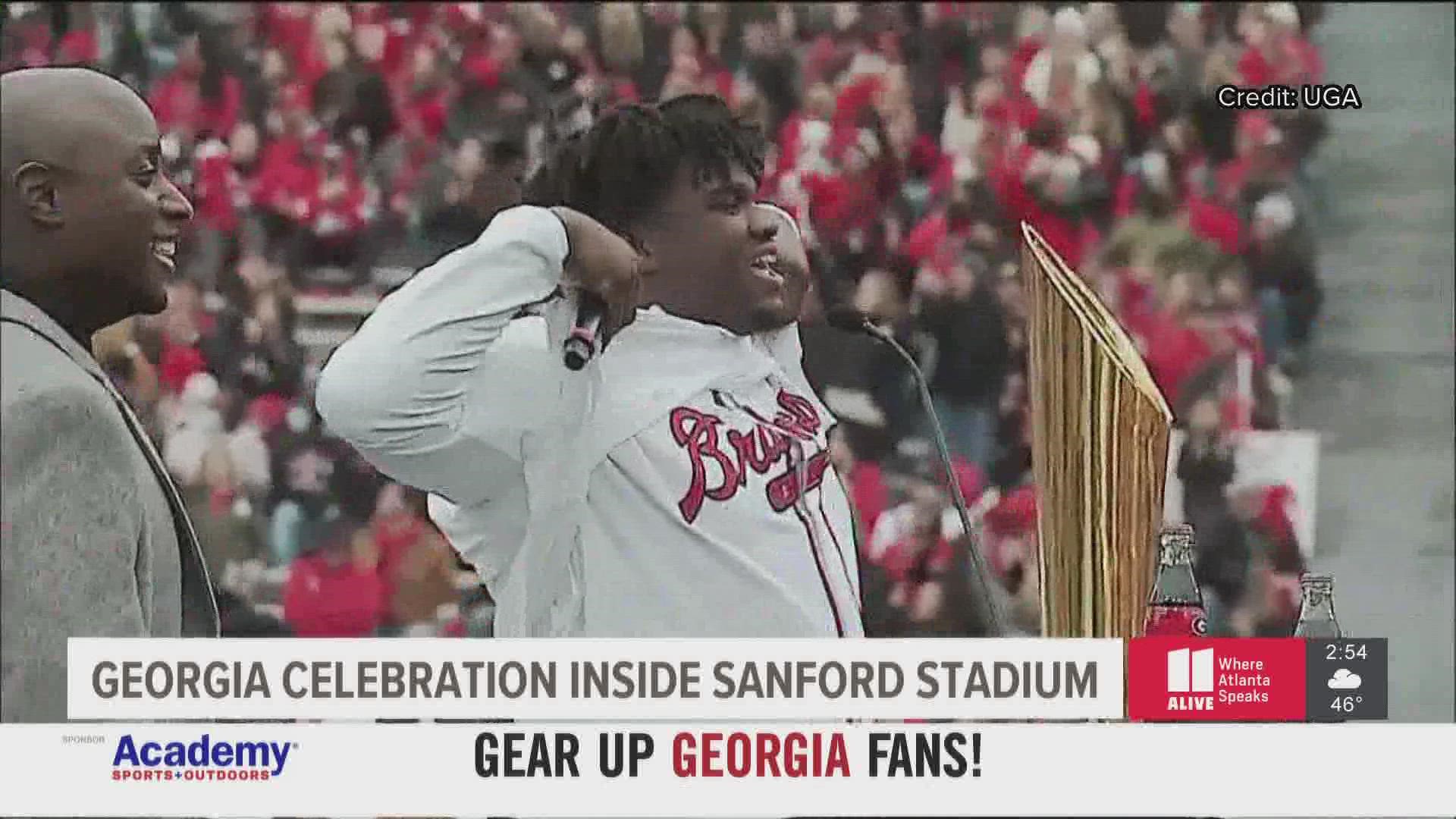 He lifted up his shirt to show off his Braves jersey.