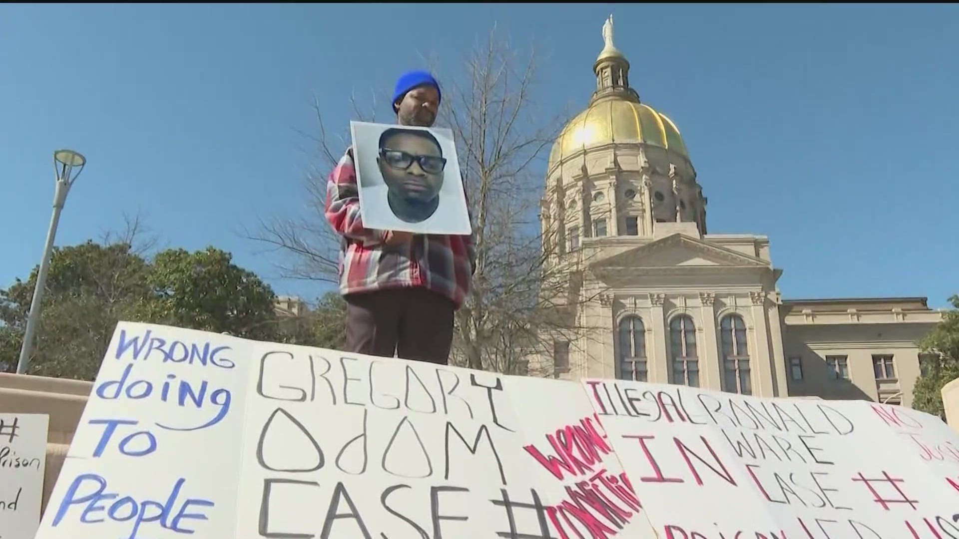 Families and friends of inmates rallied at the state Capitol to protest conditions in the Department of Corrections.