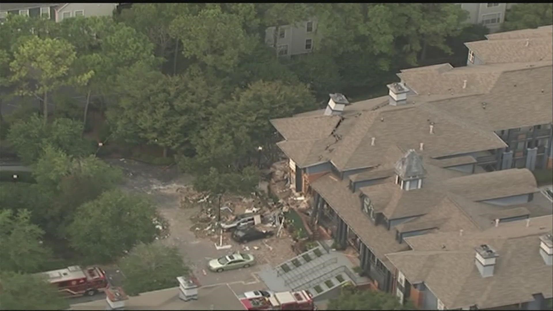 An explosion ripped through a DeKalb County apartment complex Sunday, leaving dramatic scenes of damage and injuring at least four people according to fire officials