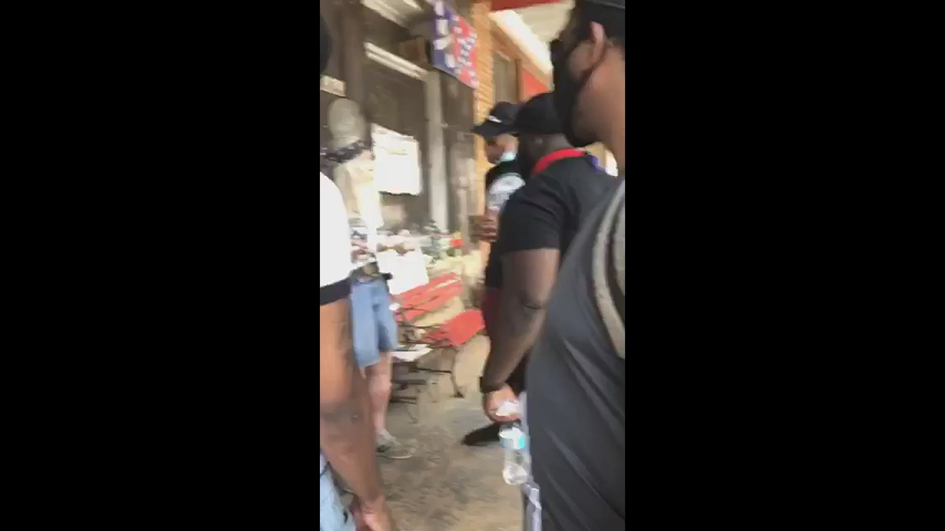 A group of demonstrators in Kennesaw, Georgia confronted a shop owner known in the community for selling racist relics, but the exchange stayed peaceful.