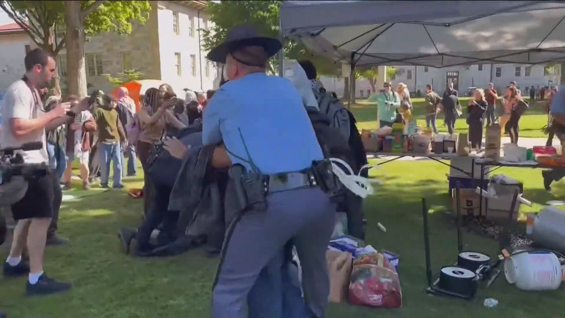 Numerous demonstrators were detained on Thursday and a crowd of people are still out early Friday morning.