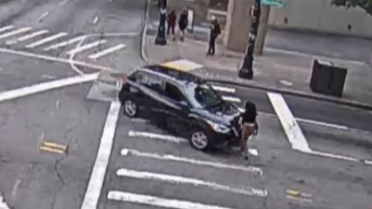 Video shows alleged Atlanta hit-and-run driver move victim to sidewalk before leaving scene