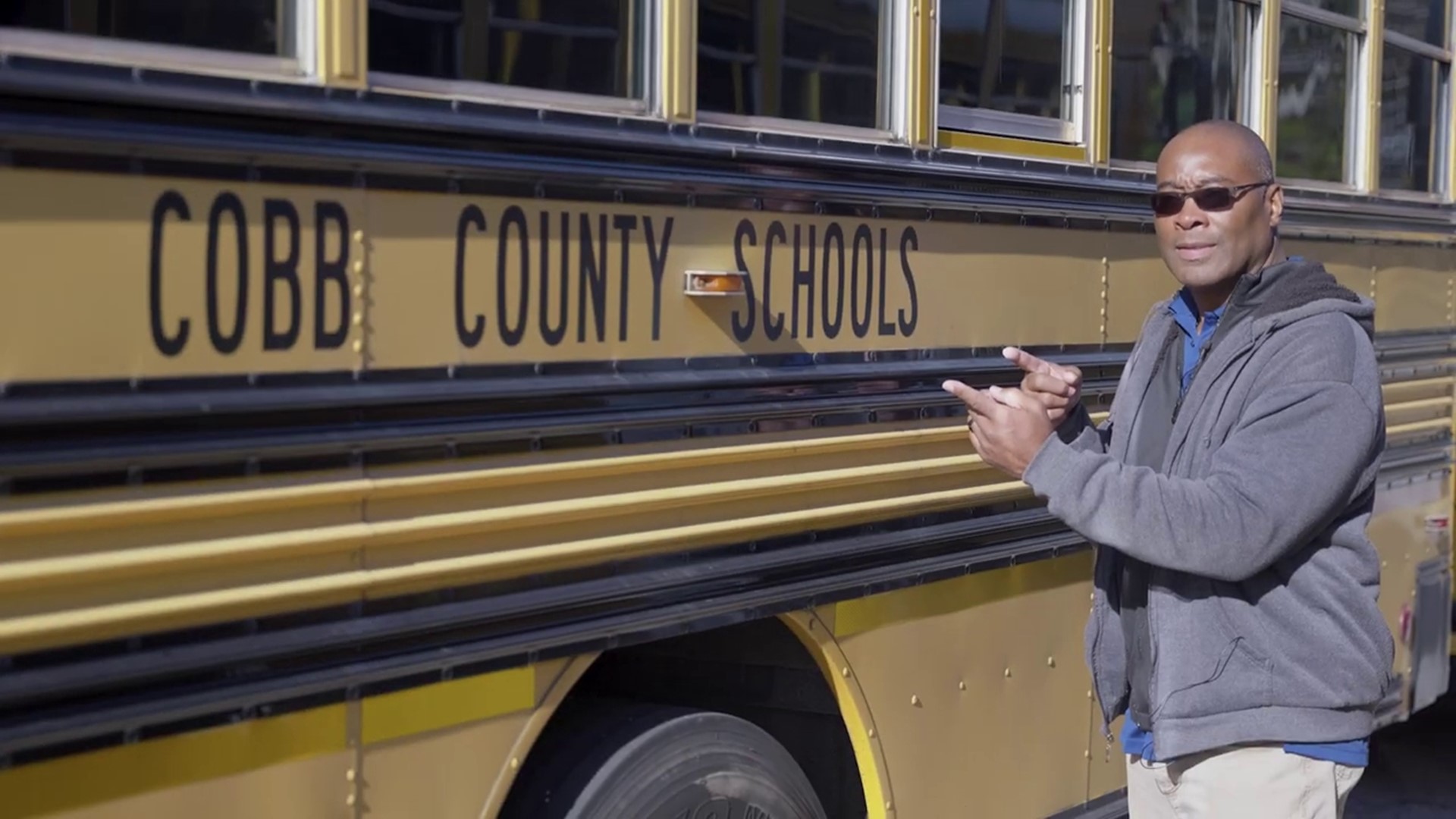 A Cobb Schools bus driver with just one month under his belt has already earned the title of hero after saving a student's life on his route.