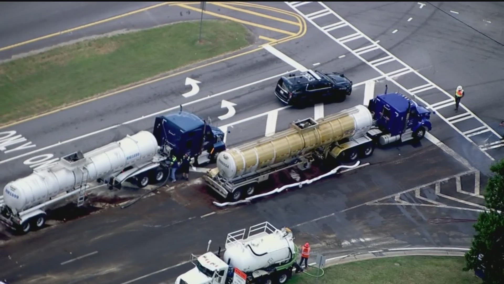 Crews are working to clean up an oil spill in Newnan, which is causing several road closures on Friday.