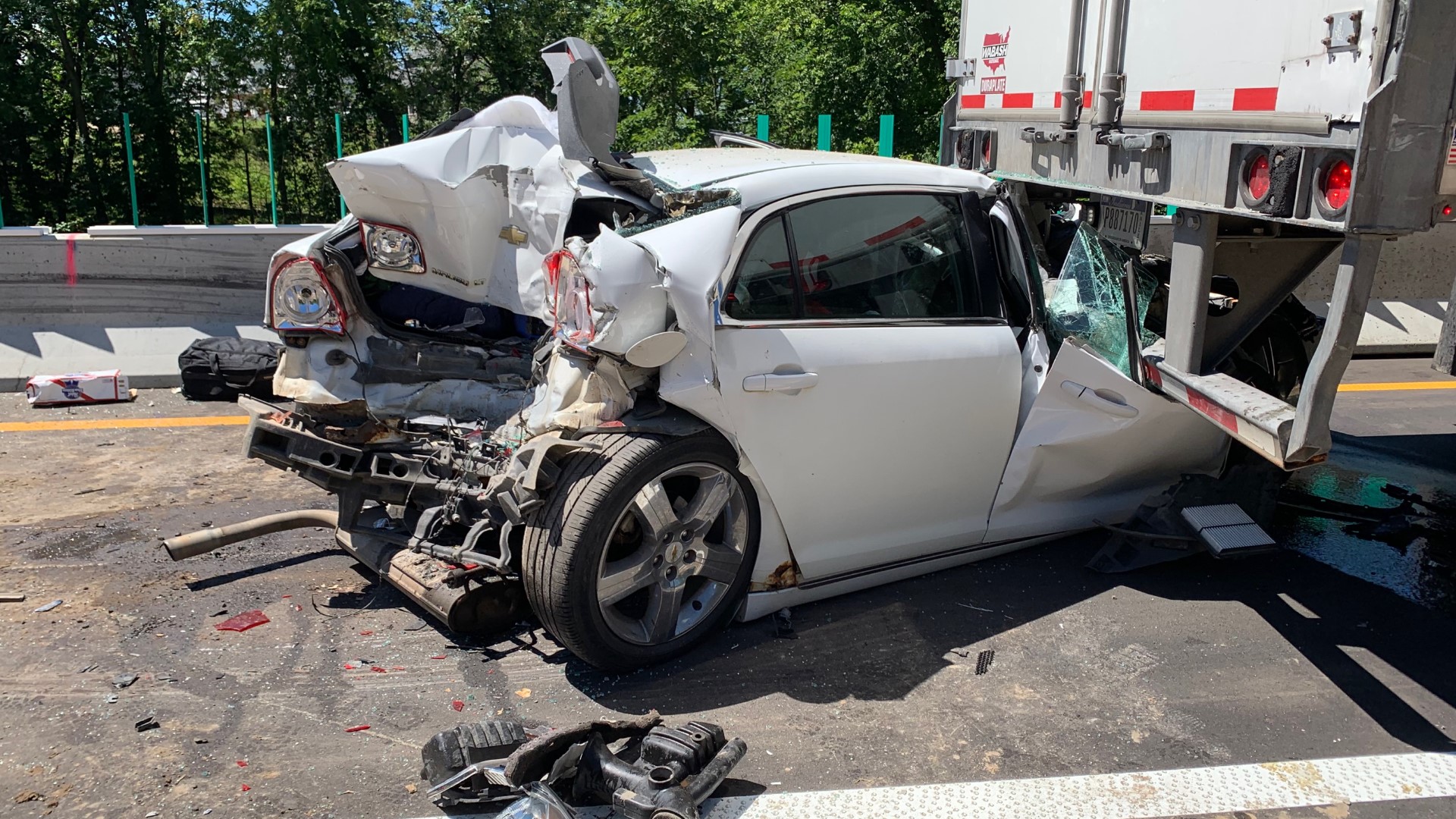 Three people sustained serious injuries after a car ran into the back of a semi that was stopped for construction backup. A 14-year-old later died from his injuries.